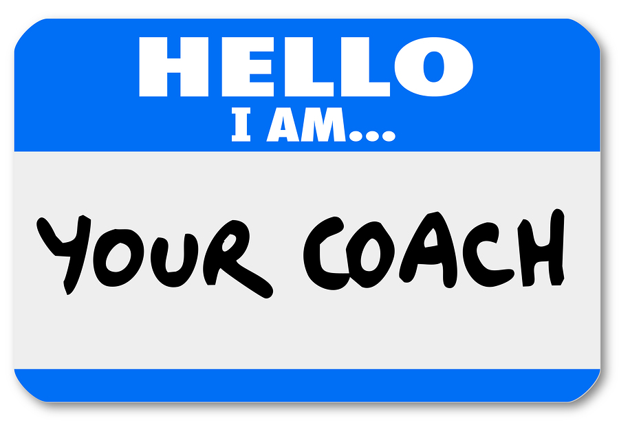 A nametag sticker with the words Hello I Am Your Coach